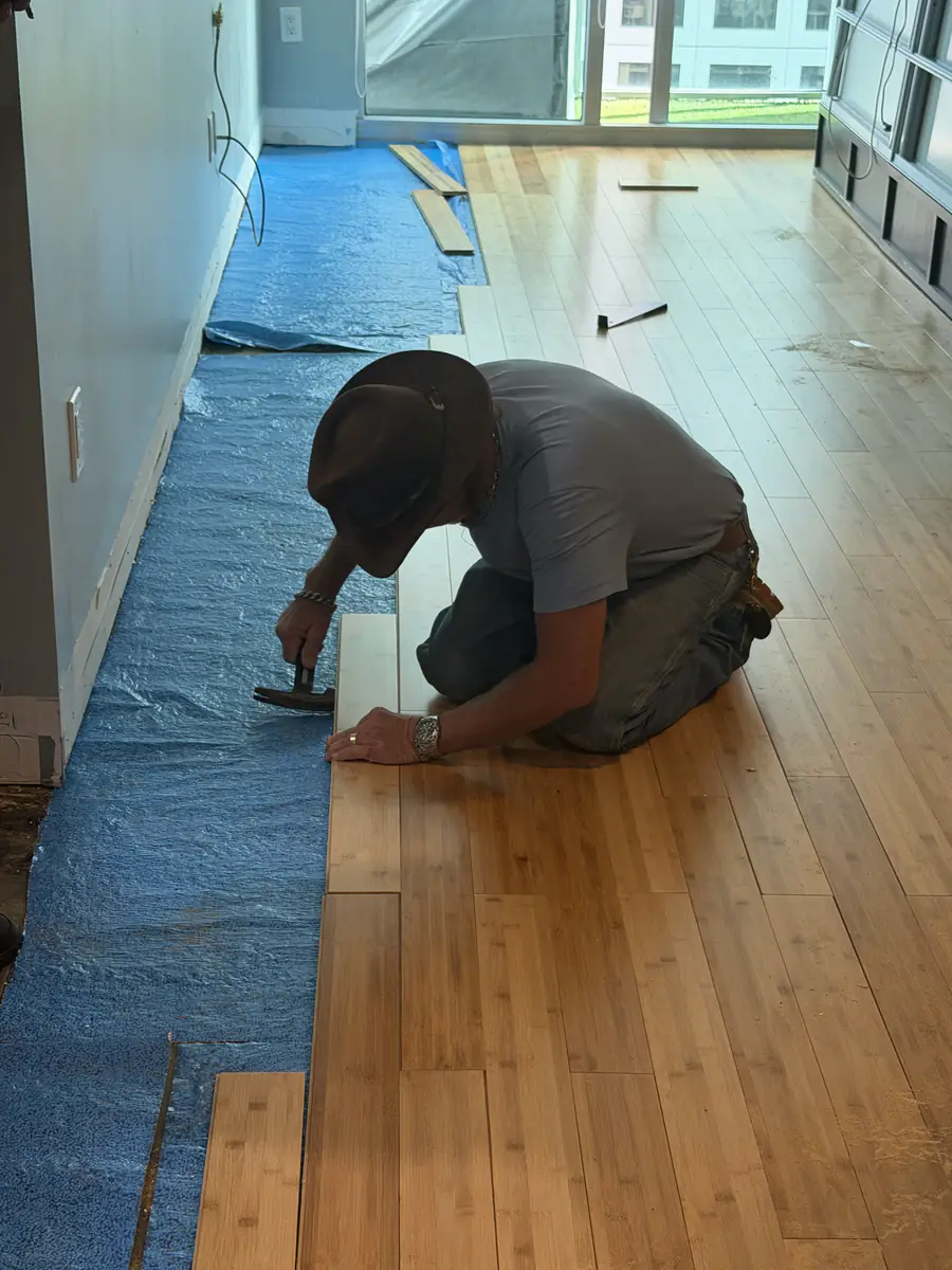 Cutting a plank to fit — Ibis Repair Group, South Florida
