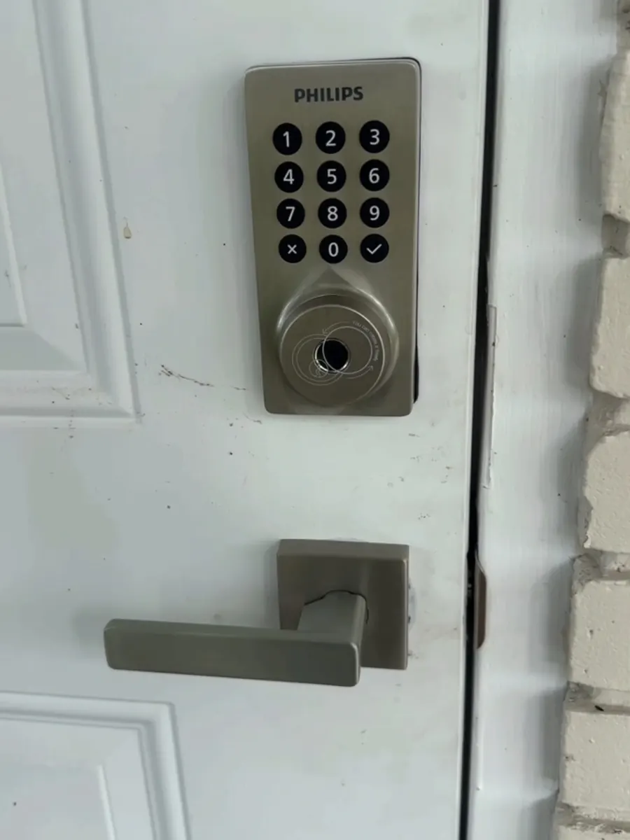 A keypad deadbolt and lever handle newly fitted to a front door