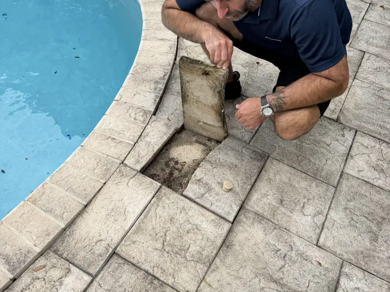 Repairing a pool deck drain