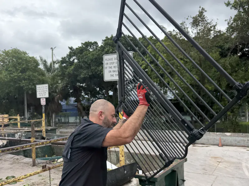 Removing an old metal railing on a commercial job